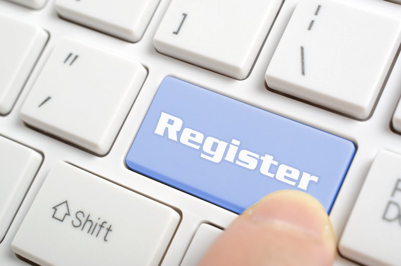 Photo of person about to click a button titled Register